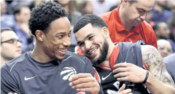  ?? FRANK GUNN/THE CANADIAN PRESS ?? Raptors DeMar DeRozan, left, and Fred VanVleet react on the bench during Toronto’s 133-99 win over the Cleveland Cavaliers on Thursday. Toronto faces the Golden State Warriors on Saturday.