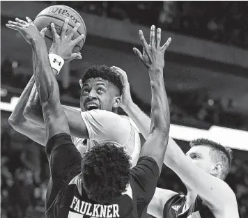  ?? Harry How / Getty Images ?? Jarrett Culver, top, had his way with Northern Kentucky’s defense on Friday, scoring 29 points with eight rebounds and seven assists to lift Texas Tech into the second round of the NCAA Tournament.