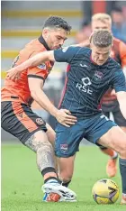  ?? ?? Tony Watt tackles Dundee United old boy Blair Spittal.