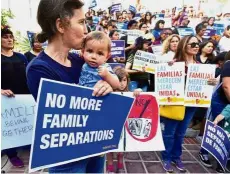  ?? — AFP ?? Kids need their parents: People gathering for a rally organised by civil rights organisati­ons on the steps of City Hall in Los Angeles, California.