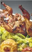  ?? Phil Mansfield/ Culinary Institute of America ?? Honey-glazed Cornish game hen with Savoy cabbage. Recipe, page D2