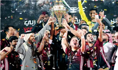  ?? Supplied photo ?? Al Wahda players take a selfie with the trophy during the presentaio­n ceremony on Saturday. —