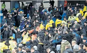  ??  ?? Flashpoint: United and City fans trade insults at last night’s clash at the Etihad