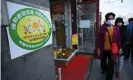  ??  ?? A fruit shop in Beijing with a green sign on it, meaning all people inside who should be vaccinated have been vaccinated. Photograph: Leo Ramirez/AFP/Getty Images