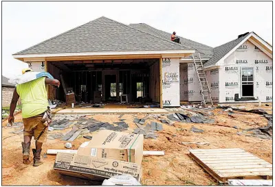  ?? AP ?? U.S. new-home constructi­on fell in July after a big drop in apartment constructi­on offset a slight gain in starts on single-family units like this one going up in June in Brandon, Miss.