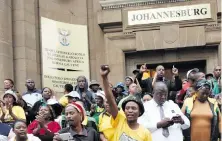  ?? Picture: Nigel Sibanda ?? SUPPORT. North West ANC branch members outside court to champion Supra Mahumapelo.