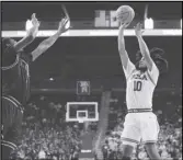  ?? ?? UCLA guard Tyger Campbell (10) shoots against Long Beach State during the second half on Friday, in Los Angeles. Campbell passed 1,000 points in the game.