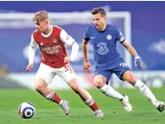  ??  ?? Arsenal midfielder Emile Smith Rowe (left) proved to be the difference in the Premier League match