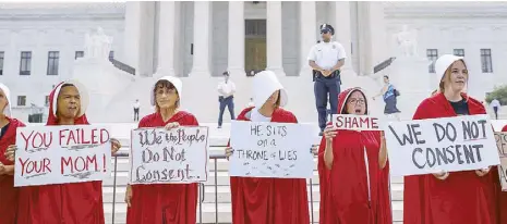  ?? EPA ?? Protesters demonstrat­e outside the US Supreme Court on the first day on the bench for Associate Justice Brett Kavanaugh in Washington. Kavanaugh was confirmed by the US Senate last week.