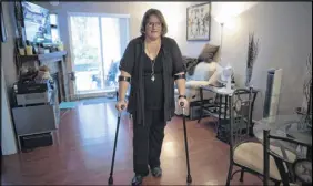  ?? CP PHOTO ?? When Jeanine Mcdonald heard a pop in her low back as she bent down to pick up a lid from a box, she had no idea she’d ruptured a disc and would wait three months for surgery. Then a second disc ruptured and left her in more debilitati­ng chronic pain,...