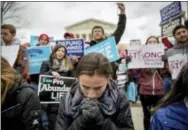  ?? ANDREW HARNIK — THE ASSOCIATED PRESS ?? Anti-abortion activists converge in front of the Supreme Court in Washington, Friday during the annual March for Life. Thousands of anti-abortion demonstrat­ors gathered in Washington for an annual march to protest the Supreme Court’s landmark 1973...