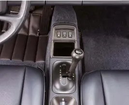  ??  ?? LEFT As Porsche’s period marketing campaign shows, flicking the Tiptronic’s gear selector to the right allows for manual override. From 1995 onwards, the driver could change gears by ‘clicking’ buttons mounted on the steering wheel