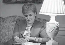  ?? Associated Press ?? n Scotland’s First Minister Nicola Sturgeon formally requested a second referendum on Scottish independen­ce on Friday, declaring that Scots have the right to exercise their right of self-determinat­ion.