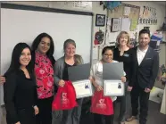  ?? Christina Cox/The Signal ?? From left to right, Gloria Rogers of California Credit Union, Mariam Nasiry of California Credit Union, special education teacher Kayla Bastedo, second grade teacher Beatriz Vargas, Superinten­dent Catherine Kawaguchi and Principal Eric Guerrero pose...