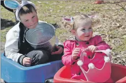  ?? ASHLEY THOMPSON ?? Five-year-old Sam Surette and his two-year-old sister Naomi Surette hitched a ride in their wagon after hunting for Easter eggs at Kentville’s Miner’s Marsh.