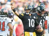  ?? JOE SARGENT/GETTY ?? QB Mitch Trubisky came off the bench to help rally the Steelers for a win over the Buccaneers on Sunday.