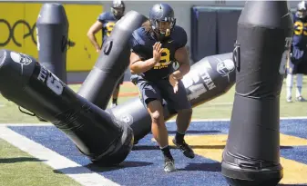  ?? Michael Macor / The Chronicle ?? Cal defensive line coach Fred Tate says James Looney (above), a transfer from Wake Forest, is “a big guy inside who’s athletic and can move and push the pocket.’’