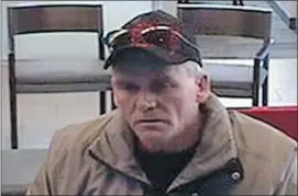  ?? Calgary Police Service ?? A suspect in bank robberies across Western Canada is shown on surveillan­ce video.