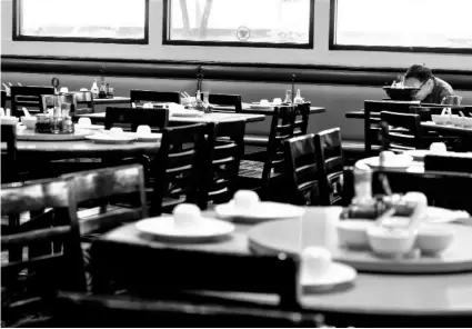  ?? AP Photo/Ringo H.W. Chiu ?? In this March 12 file photo, a diner eats lunch at a restaurant in Rosemead, Calif.