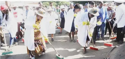  ??  ?? First Lady Amai Auxillia Mnangagwa (left) leads the Bulawayo clean up campaign accompanie­d by the Minister of State for Bulawayo Provincial Affairs Cde Judith Ncube (right) yesterday. (Picture by Eliah Saushoma)