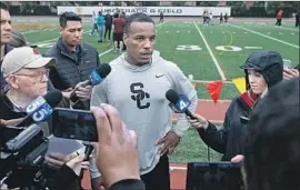  ?? Alex Gallardo Associated Press ?? USC CORNERBACK Iman Marshall talks to reporters during pro day. He says everyone wants to know about his transition from cornerback to safety.