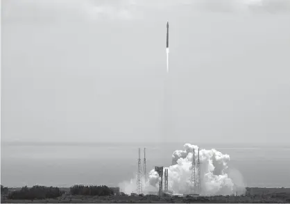  ?? Associated Press ?? ABOVE: A United Launch Alliance Atlas V rocket carrying supplies for the Internatio­nal Space Station lifts off from complex 41 at the Cape Canaveral Air Force Station on Tuesday in Cape Canaveral, Fla.