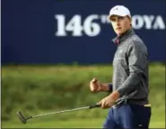  ?? DAVE THOMPSON — THE ASSOCIATED PRESS ?? Jordan Spieth celebrates on the 18th green after the third round of the British Open on Saturday.