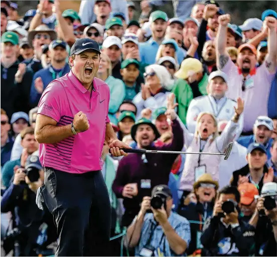  ?? CURTIS COMPTON / CCOMPTON@AJC.COM ?? Patrick Reed makes a par putt on the 18th green to win the Masters at 15 under at Augusta National Golf Club on Sunday. Reed finished one shot ahead of Rickie Fowler and two ahead of former Masters winner Jordan Spieth.