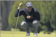  ?? Jeff Chiu ?? Tiger Woods lines up a putt on the third hole during the second round of the PGA Championsh­ip golf tournament at TPC Harding Park Friday, Aug. 7, 2020, in San Francisco.