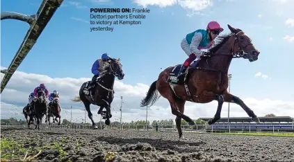  ??  ?? POWERING ON: Frankie Dettori partners Enable to victory at Kempton yesterday