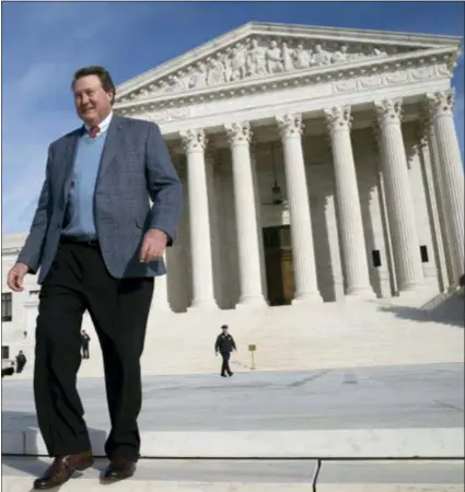  ?? J. SCOTT APPLEWHITE — THE ASSOCIATED PRESS ?? Mitch Hungerpill­er of Birmingham, Ala., who invented a computeriz­ed system to automate the processing of returned mail, visits the Supreme Court in Washington, on where his decade-long fight with the post office over patent infringeme­nt will be heard.