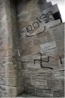  ??  ?? Shameful Vandals painted graffiti on St John’s Tower earlier this year