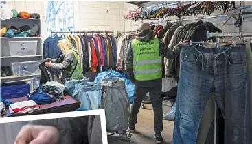  ?? — Photos: dpa ?? donated clothing hangs on the clothes rails at a charity which also runs an emergency shelter for homeless people and an outpatient clinic for those in need who are not insured.