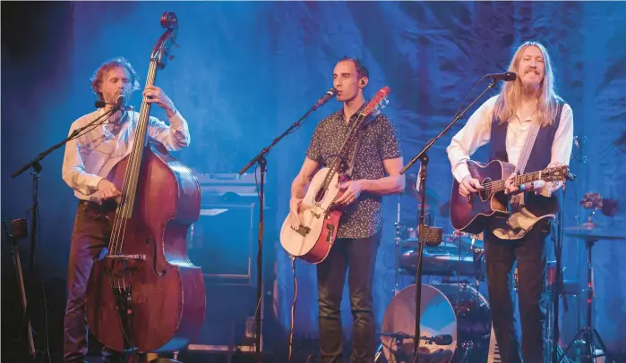  ?? DAVID A. SMITH/GETTY ?? Chris Wood, left, Jano Rix, and Oliver Wood of The Wood Brothers will perform Sunday at Penn’s Peak near Jim Thorpe.