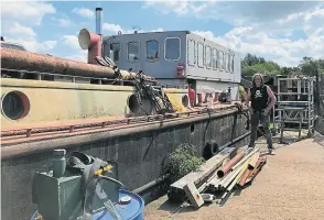  ?? PHOTO: SALLY CLIFFORD ?? Nathan Rumbold with one of his historic boats.