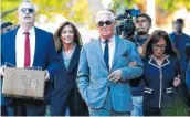  ?? AP PHOTO /MANUEL BALCE CENETA ?? Roger Stone, with his wife, Nydia Stone, right, arrive at the federal court in Washington on Tuesday.