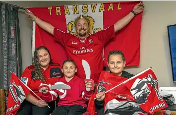  ?? STACY SQUIRES/ STUFF ?? A house divided . . . Reinart van Rooyen, back, is a staunch Lions supporter but his wife Elaine, and boys Quade,
8, and Yurick,
10, are backing the Crusaders to win tomorrow night’s Super Rugby final.