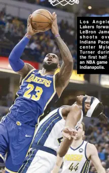  ??  ?? Los Angeles Lakers forward LeBron James shoots over Indiana Pacers center Myles Turner during the first half of an NBA game in Indianapol­is.