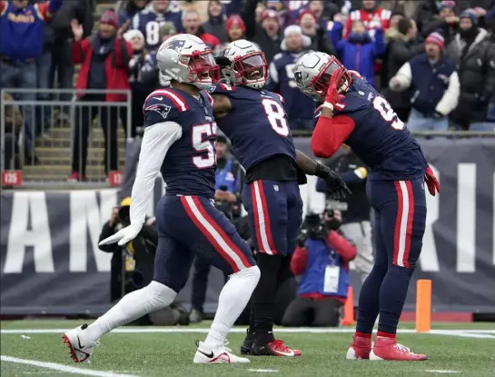  ?? Mary schwalm photos / ap ?? New england patriots, from left, Kyle van Noy, Ja'whaun bentley and matt Judon celebrate a defensive play during sunday’s win over the tennessee titans. below, safety Kyle dugger celebrates after recovering a fumble during sunday’s win over the titans.