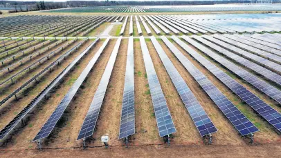  ?? JIM VONDRUSKA • REUTERS ?? A drone view shows solar panels as they stand on Dave Duttlinger's farmland that he leased to Dunns Bridge Solar LLC in Wheatfield, Indiana, U.S., April 5.