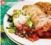  ?? Greg Morago / Staff ?? El Charro Cafe serves a burrito filled with carne seca served enchilada style.