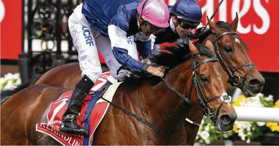  ?? Photo: Julian Smith/AAP ?? LEADING HOPE: Rekindling beats stablemate Johannes Vermeer home to win the 2017 Melbourne Cup.