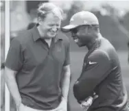  ?? Andy Cross, The Denver Post ?? NFL commission­er Roger Goodell, left, shares a laugh with Broncos coach Vance Joseph on Thursday at Dove Valley.