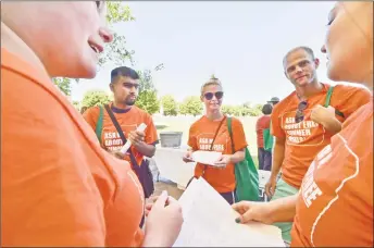  ?? Peter Hvizdak / Hearst Connecticu­t Media ?? From left, Alexa Davidson, Ryan Munasinghe, Luce Terril and her husband, Dustin Terril, and Alana Davidson, Alexa’s sister, prepare to canvass for End Hunger Connecticu­t! at the De Gale Field in New Haven, spreading the word about free lunches and...