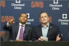  ?? PHIL LONG— ASSOCIATED PRESS ?? New Cavs general manager Koby Altman, left, and chairman Dan Gilbert take questions during a news conference at the team’s training facility in Independen­ce on July 26.