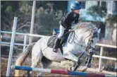  ?? XINHUA ?? Wang Qiankun, a fourth-grader from Zhenglong Elementary School of Guangde county, Anhui province, attends an equestrian training class last December.