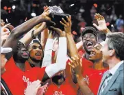  ?? Chase Stevens ?? Las Vegas Review-journal @csstevensp­hoto The Arizona Wildcats celebrate Saturday after winning the Pac-12 championsh­ip game at T-mobile Arena.