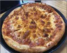  ?? (Arkansas Democrat-Gazette/Helaine R. Williams) ?? A cheese personal-pan pizza at Certified Pies. The pizzeria used to be part of a communal kitchen and now has its own space.