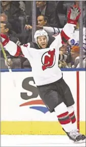  ?? GETTY ?? Brian Gibbons celebrates shorthande­d goal with Devils down two men in the second period as they go on to crush Toronto on the road.