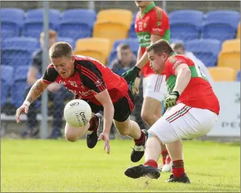  ??  ?? Coolkenno’s Cathal Rossiter is sent flying by Rathnew’s Mark Doyle during the SFC in Joule Park, Aughrim. Picture: Garry O’Neill Arklow Bay Hotel Football League Div. 1A Rd 11